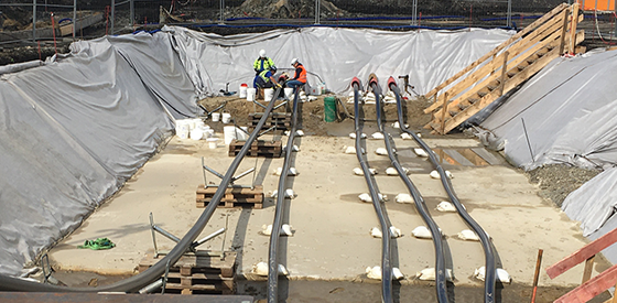 panned out image multiple cable pulls in a trench 560 x 275p